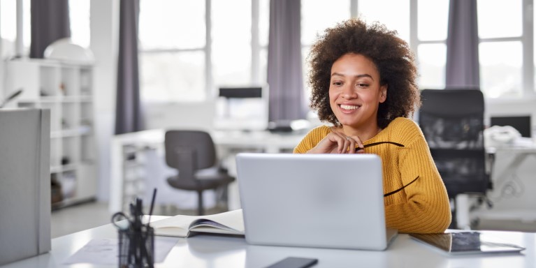 Person using a laptop in an office
