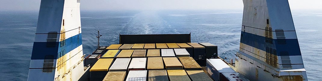 Shipping containers being carried across the sea