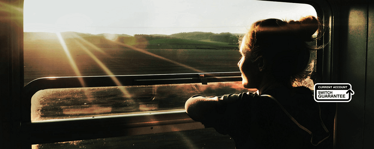 A woman staring out of a train window