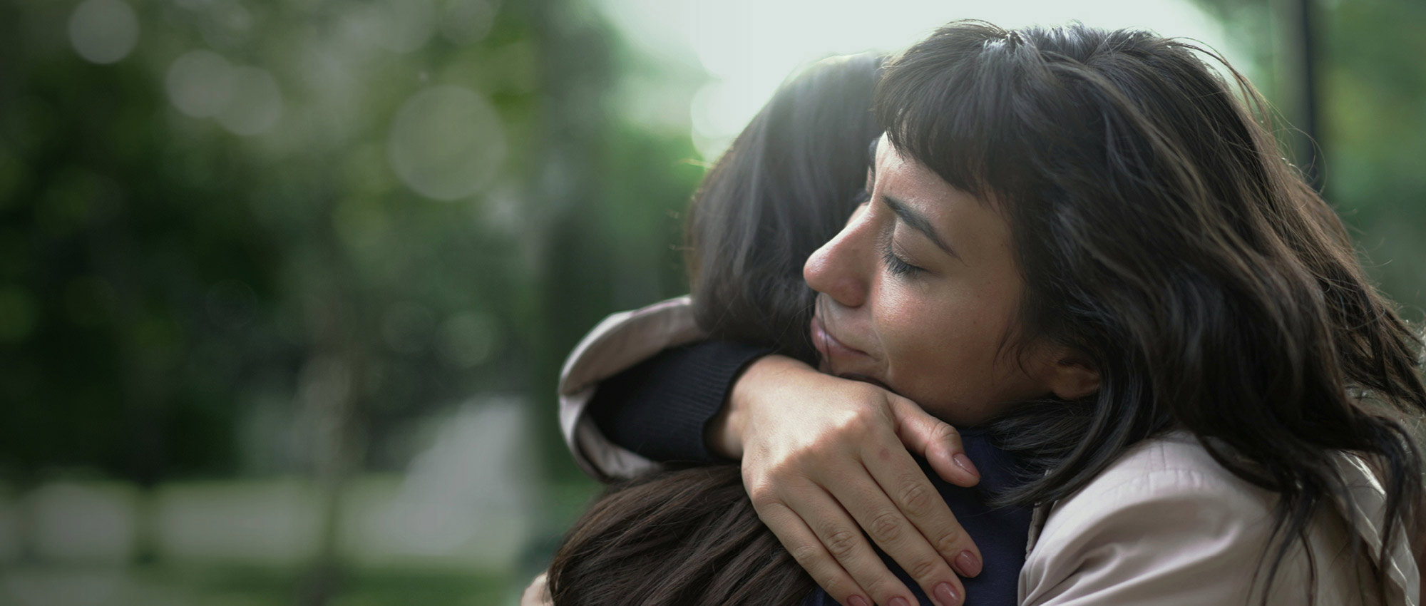 Two women hugging