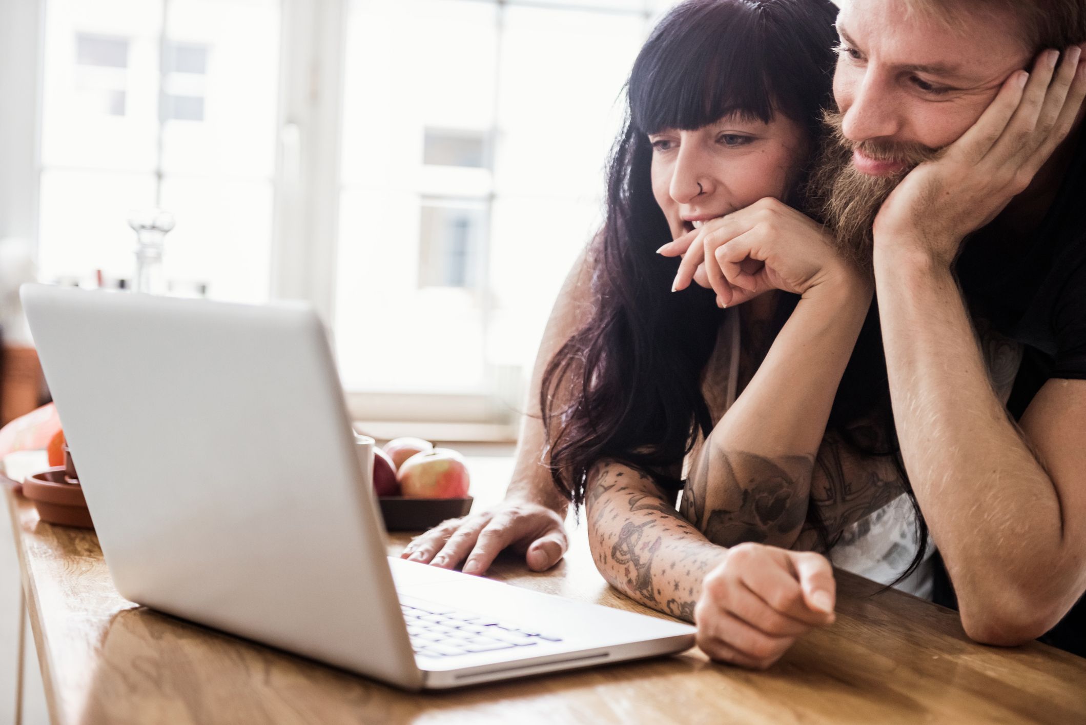 Image showing a young couple looking at their investment options.