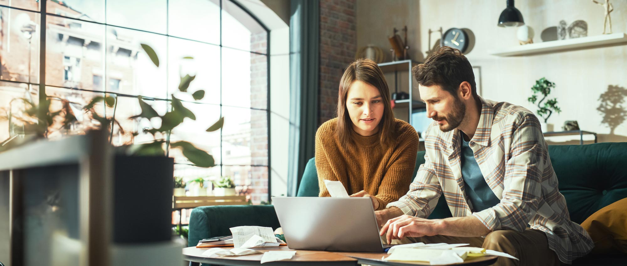 Man and woman looking at laptop.