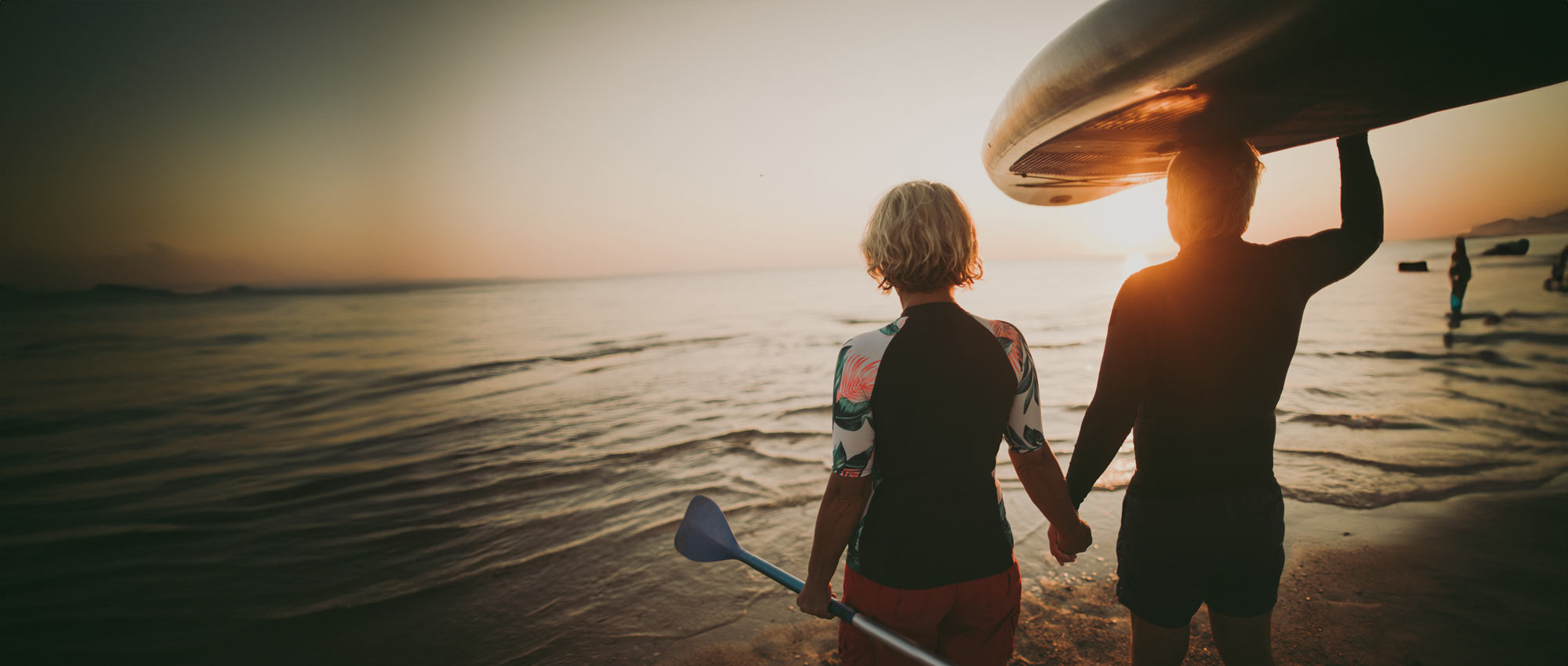 Man and woman surfing.