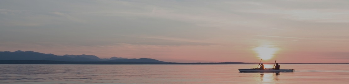 Horizon view of of lake and conoeing boat